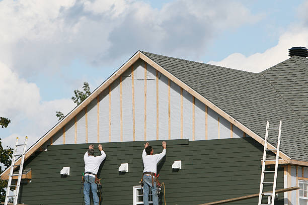 Professional Siding Contractor technician working in Islip Terrace, NY